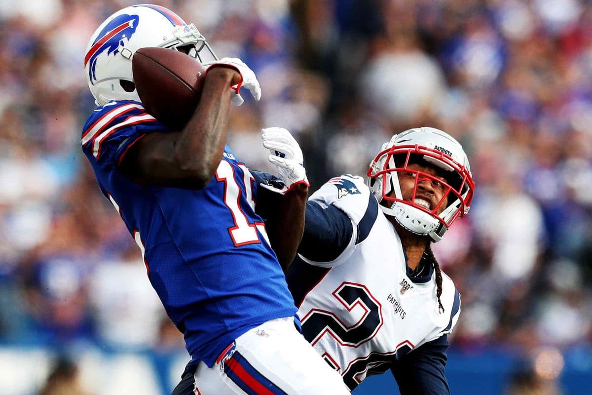 ORCHARD PARK, NEW YORK - SEPTEMBER 29: John Brown #15 of the Buffalo Bills catches a pass from Matt Barkley #5 of the Buffalo Bills as Stephon Gilmore #24 of the New England Patriots attempts to defend him during the fourth quarter at New Era Field on September 29, 2019 in Orchard Park, New York. Gilmore was called for pass interference on the play. (Photo by Bryan M. Bennett/Getty Images)
