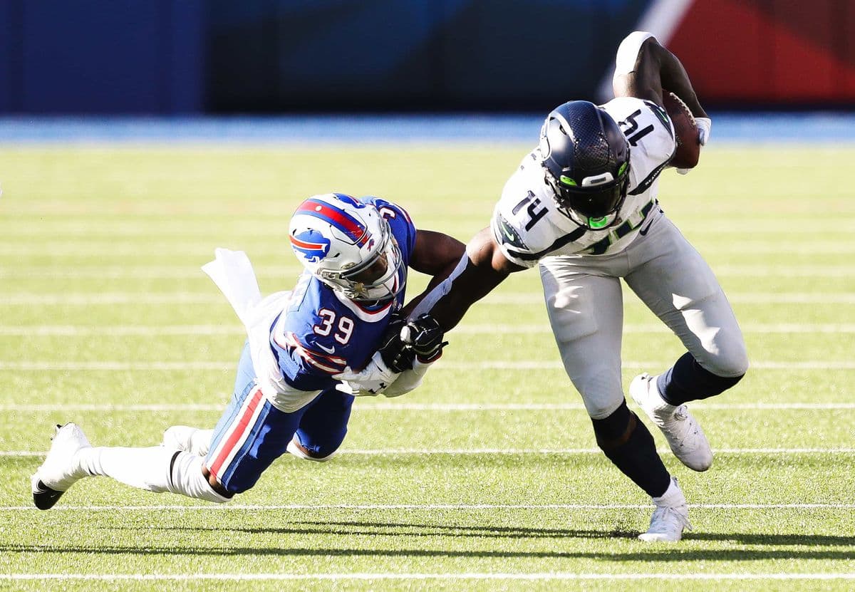 ORCHARD PARK, NEW YORK - NOVEMBER 08: Levi Wallace #39 of the Buffalo Bills tackles DK Metcalf #14 of the Seattle Seahawks during the first half at Bills Stadium on November 08, 2020 in Orchard Park, New York. (Photo by Bryan M. Bennett/Getty Images)