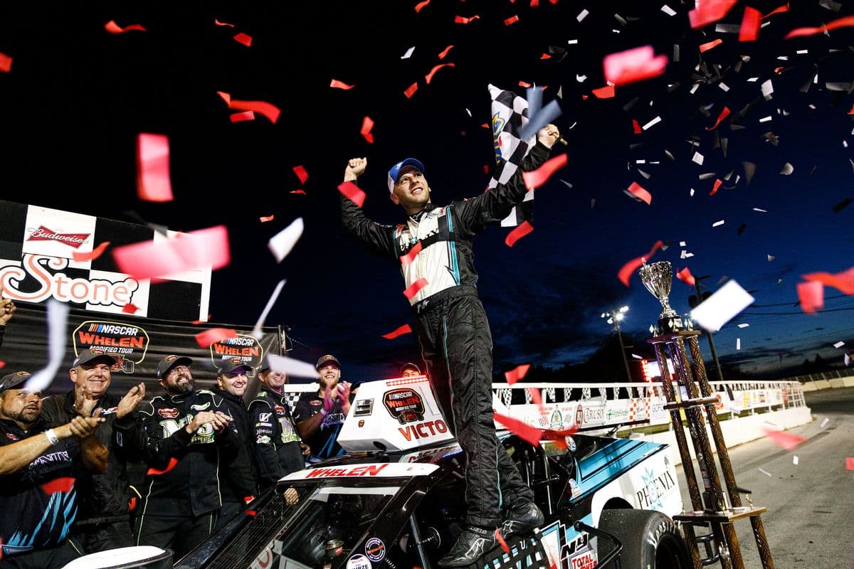 Justin Bonsignore (51) celebrates after winning the NASCAR Whelen Modified Tour Toyota Mod Classic Presented by McDonald's on Aug. 31, 2019 at Oswego Speedway in Oswego, New York. (Bryan Bennett / NASCAR)