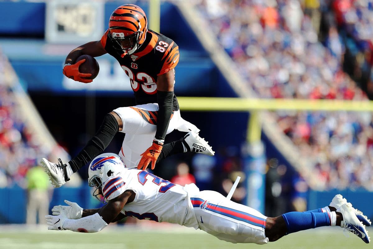 ORCHARD PARK, NEW YORK - SEPTEMBER 22: Tyler Boyd #83 of the Cincinnati Bengals leaps over Siran Neal #33 of the Buffalo Bills during a game at New Era Field on September 22, 2019 in Orchard Park, New York. (Photo by Bryan M. Bennett/Getty Images)