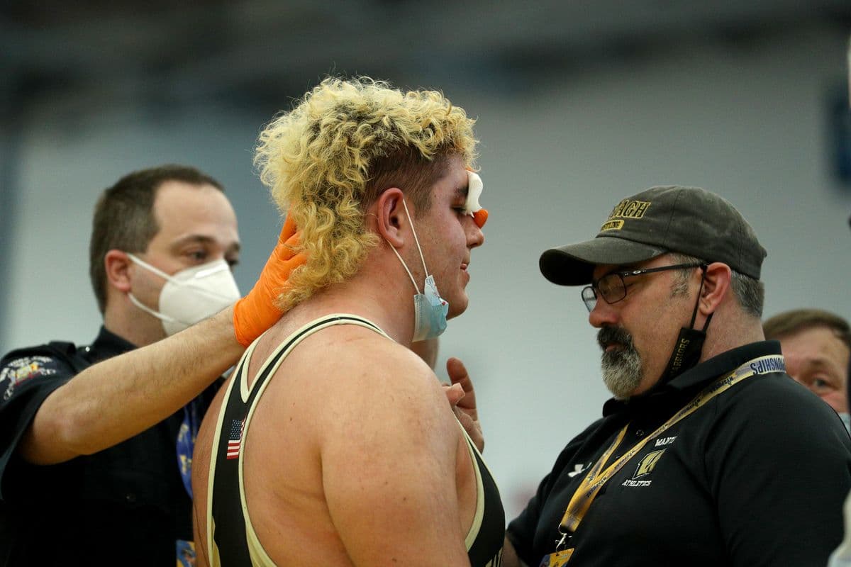 Wantagh's Nick Aldino bleeds during a match against Brentwood's Elmer Cruz during their 285 pound bout at the 2022 NYSPHSAA Wrestling Dual Meet Championships at SRC Arena in Syracuse, N.Y. on Jan. 29, 2022.