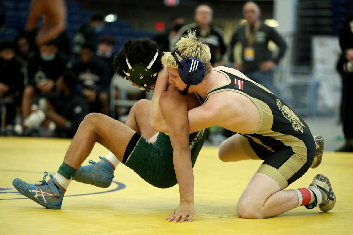 Brentwoods Brandon Reinoso attempts to escape Wantaghs Jesse Vanorden during their 145 pound bout at the 2022 NYSPHSAA Wrestling Dual Meet Championships at SRC Arena in Syracuse, N.Y. on Jan. 29, 2022.