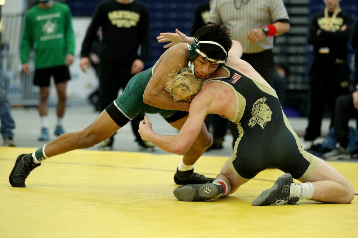 Brentwoods Juan Hernandez, left, wrestles Wantaghs Thomas Bonasera during their 138 pound bout at the 2022 NYSPHSAA Wrestling Dual Meet Championships at SRC Arena in Syracuse, N.Y. on Jan. 29, 2022.