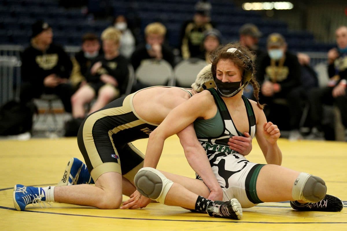 Wantagh's Joseph Clem, left, wrestles Minisink Valley's Sofia Macaluso during their 118 pound bout at the 2022 NYSPHSAA Wrestling Dual Meet Championships at SRC Arena in Syracuse, N.Y. on Jan. 29, 2022.