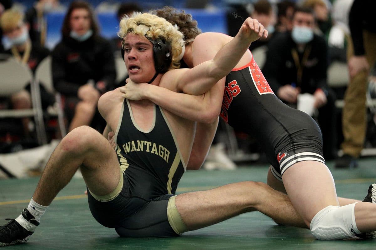Wantaghs Noah Corwin, left, and Lancasters Michael Schaefer wrestle during their 172 pound bout at the 2022 NYSPHSAA Wrestling Dual Meet Championships at SRC Arena in Syracuse, N.Y. on Jan. 29, 2022.