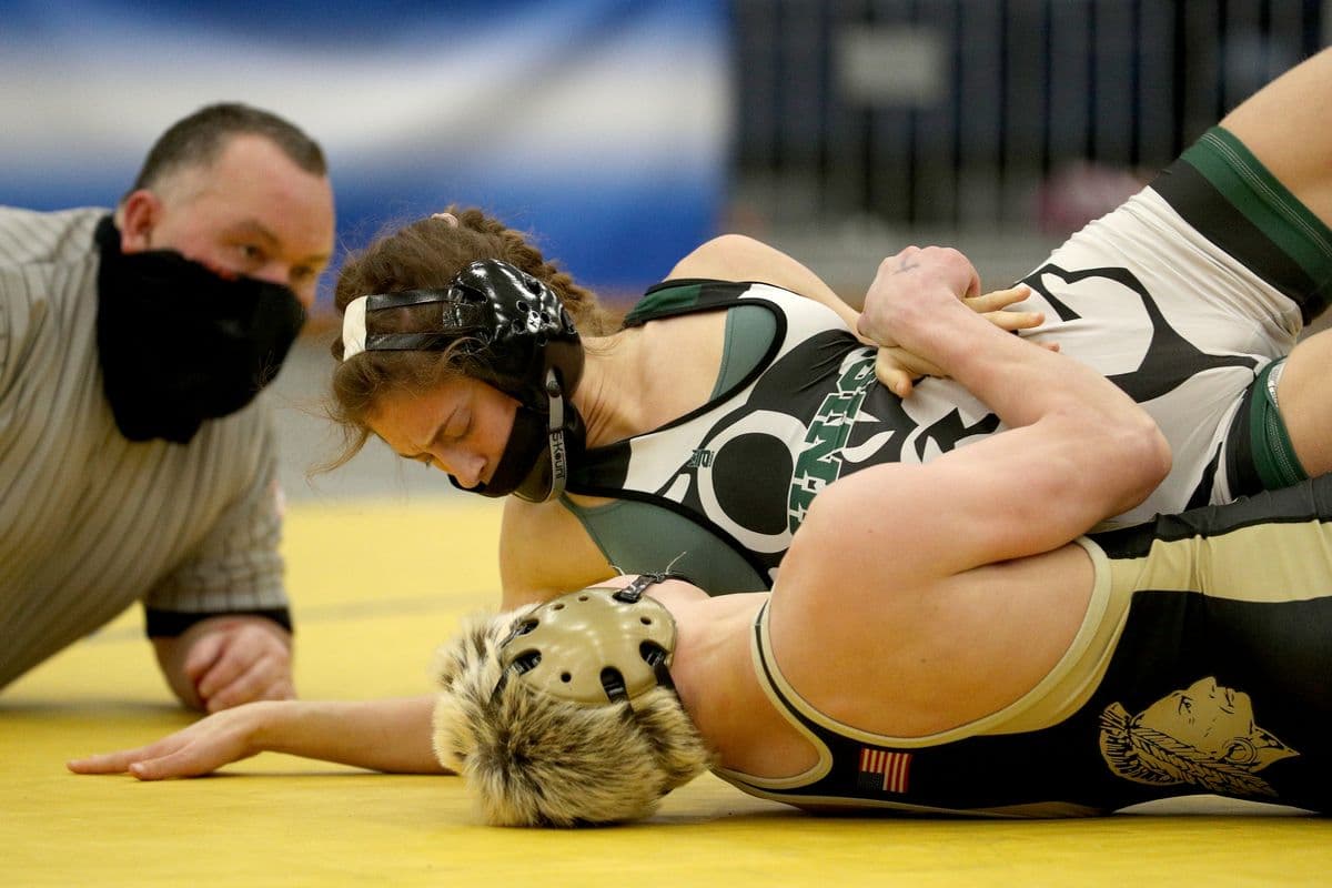 Wantagh's Joseph Clem, bottom, looks for back points as Minisink Valley's Sofia Macaluso fights off her back during their 118 pound bout at the 2022 NYSPHSAA Wrestling Dual Meet Championships at SRC Arena in Syracuse, N.Y. on Jan. 29, 2022.