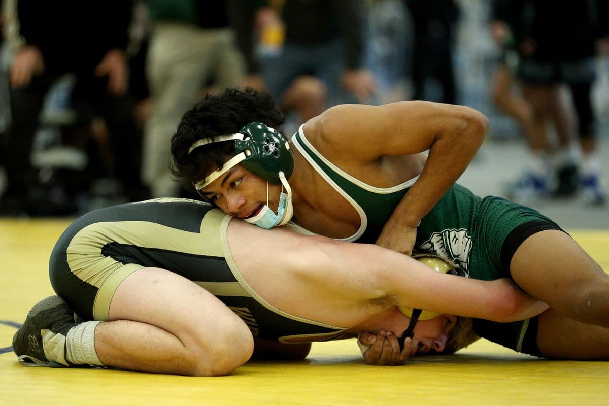 Brentwoods Juan Hernandez, top, wrestles Wantaghs Thomas Bonasera during their 138 pound bout at the 2022 NYSPHSAA Wrestling Dual Meet Championships at SRC Arena in Syracuse, N.Y. on Jan. 29, 2022.
