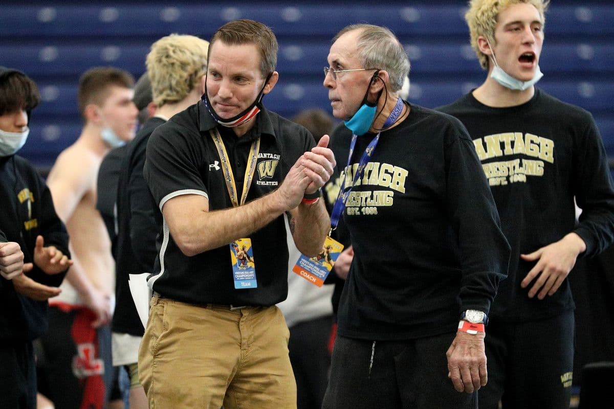Shoreham-Wading River coaches react during the 2022 NYSPHSAA Wrestling Dual Meet Championships at SRC Arena in Syracuse, N.Y. on Jan. 29, 2022.