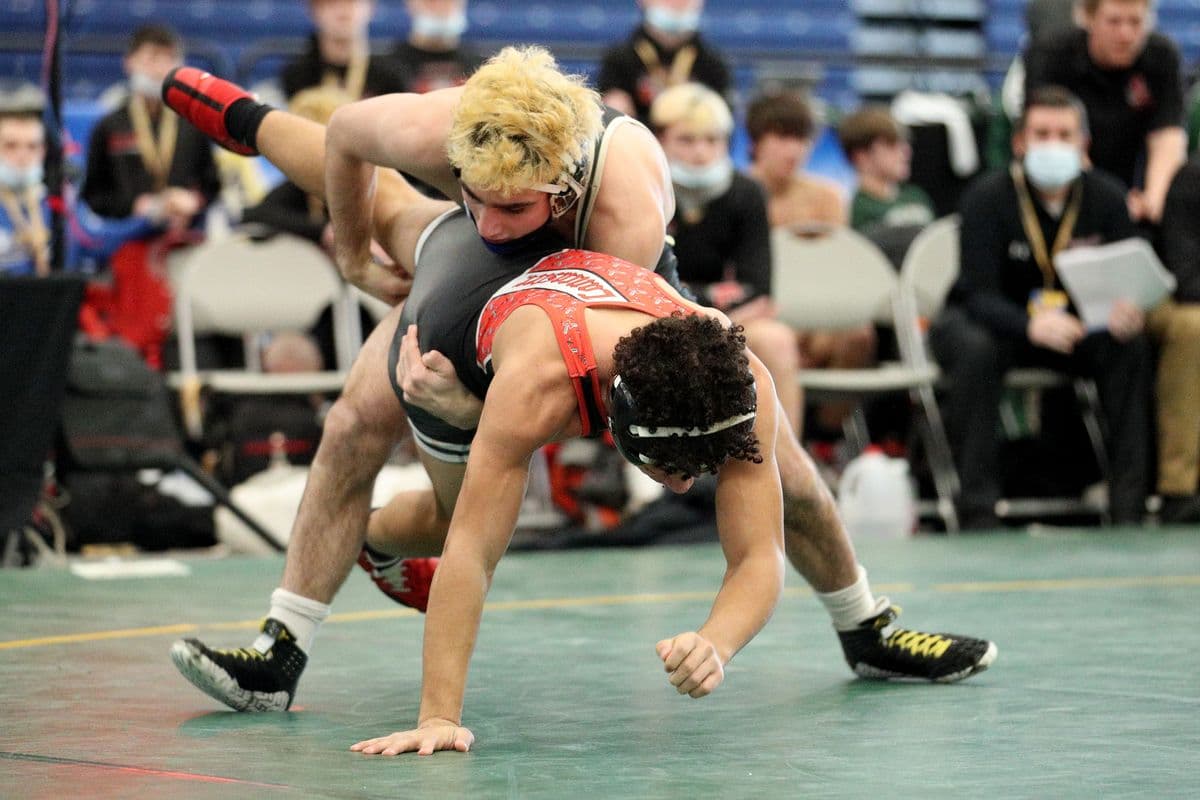 Wantaghs Ben Rogers, top, wrestles Lancasters Jayden Colon during their 152 pound bout at the 2022 NYSPHSAA Wrestling Dual Meet Championships at SRC Arena in Syracuse, N.Y. on Jan. 29, 2022.