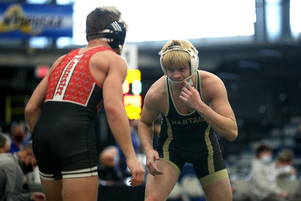Lancasters Micah Harry, left, and Wantaghs Luke Janosko wrestle during their 160 pound bout at the 2022 NYSPHSAA Wrestling Dual Meet Championships at SRC Arena in Syracuse, N.Y. on Jan. 29, 2022.