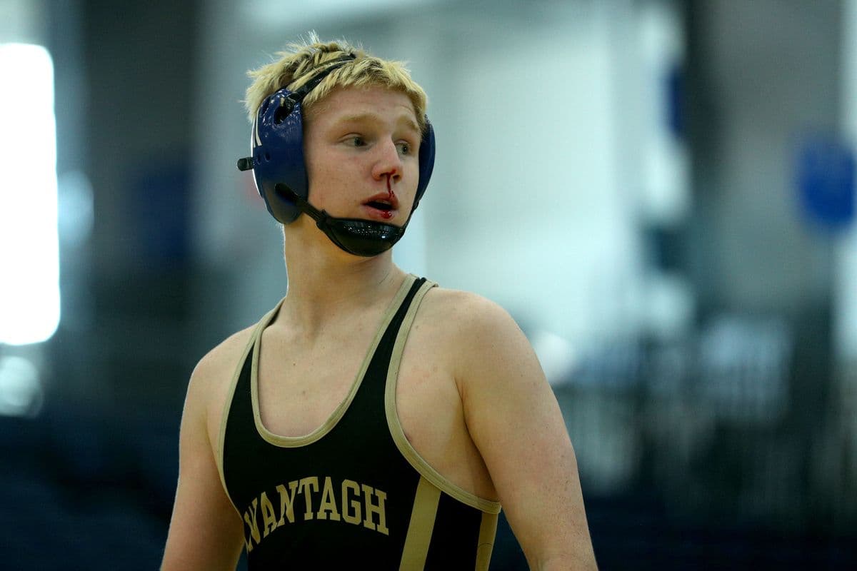 Wantaghs Jesse Vanorden takes blood time while wrestling Brentwoods Brandon Reinoso during their 145 pound bout at the 2022 NYSPHSAA Wrestling Dual Meet Championships at SRC Arena in Syracuse, N.Y. on Jan. 29, 2022.
