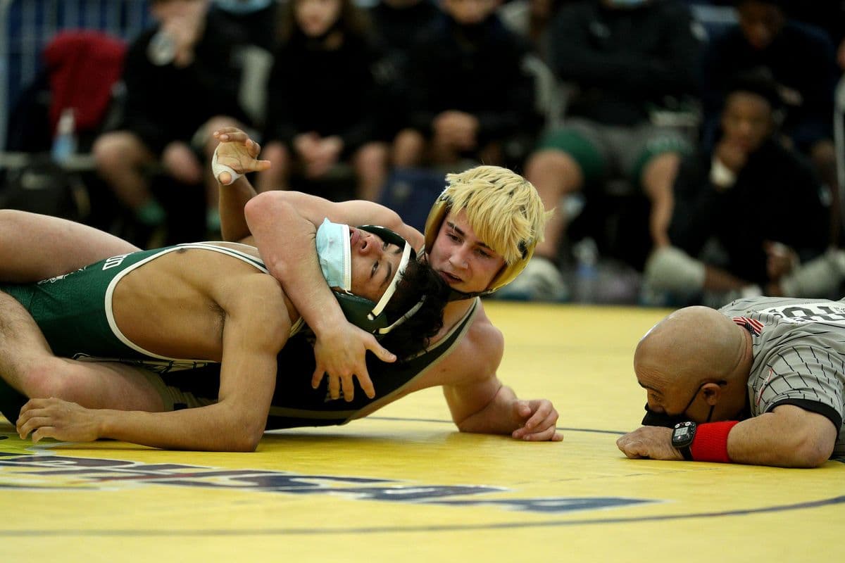 Brentwoods Juan Hernandez, left, fights off his back as Wantaghs Thomas Bonasera attempts to pin him during their 138 pound bout at the 2022 NYSPHSAA Wrestling Dual Meet Championships at SRC Arena in Syracuse, N.Y. on Jan. 29, 2022.
