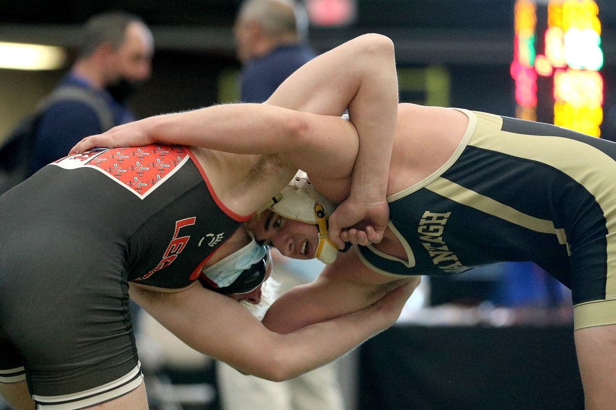 Lancasters Evan Stencel, left, wrestles Wantaghs Ethan Merone during their 189 pound bout at the 2022 NYSPHSAA Wrestling Dual Meet Championships at SRC Arena in Syracuse, N.Y. on Jan. 29, 2022.