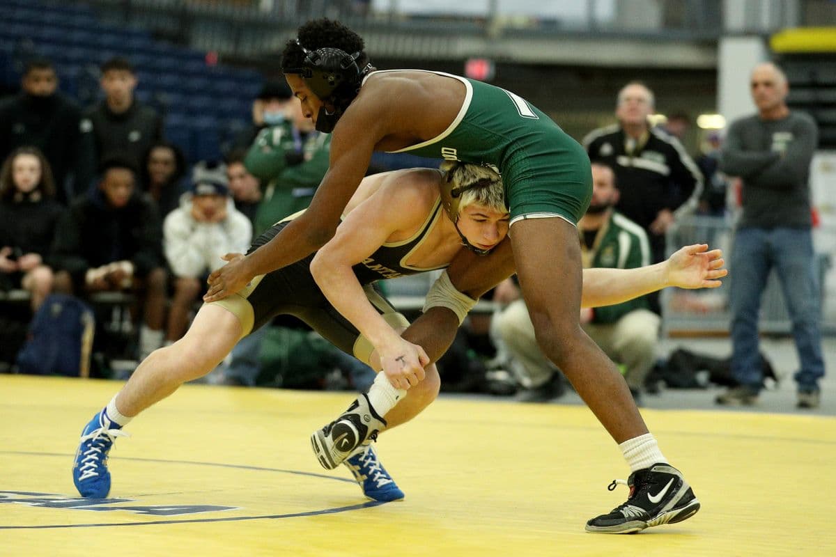 Wantagh's Joseph Clem looks to score a takedown against Brentwood's Kyle Walker during their 118 pound bout at the 2022 NYSPHSAA Wrestling Dual Meet Championships at SRC Arena in Syracuse, N.Y. on Jan. 29, 2022.