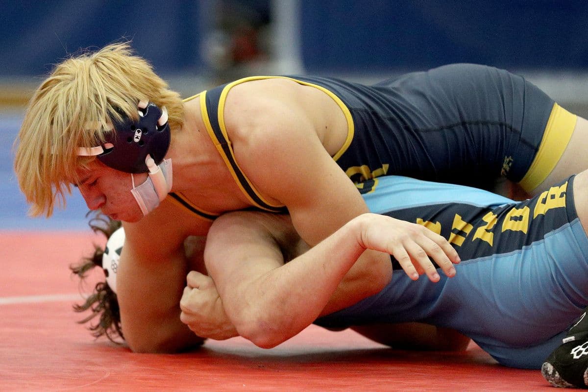 Shoreham-Wading Rivers Matt Greco, top, looks to pin Central Valley Academys Cole Wheet during their 160 pound bout at the 2022 NYSPHSAA Wrestling Dual Meet Championships at SRC Arena in Syracuse, N.Y. on Jan. 29, 2022.
