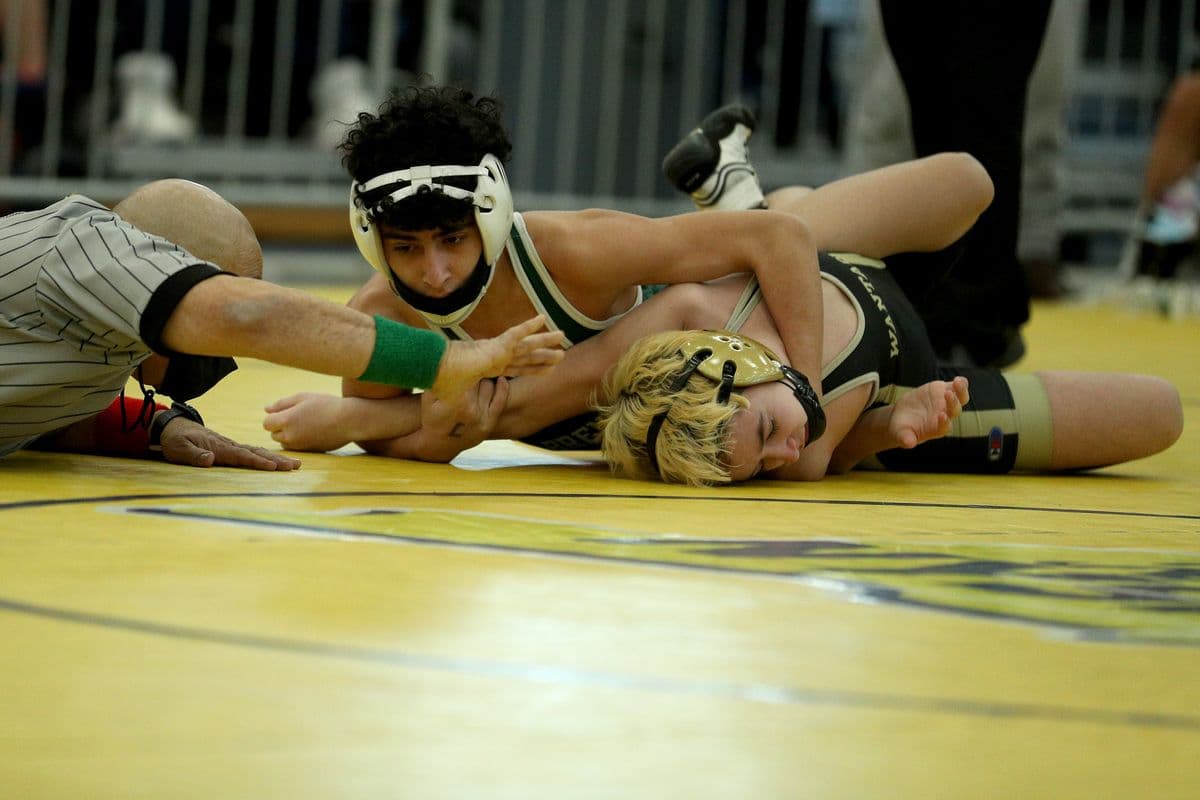 Brentwood's Jason Euceda, left, looks to pin Wantagh's Darren Santucci during their 102 pound bout at the 2022 NYSPHSAA Wrestling Dual Meet Championships at SRC Arena in Syracuse, N.Y. on Jan. 29, 2022.