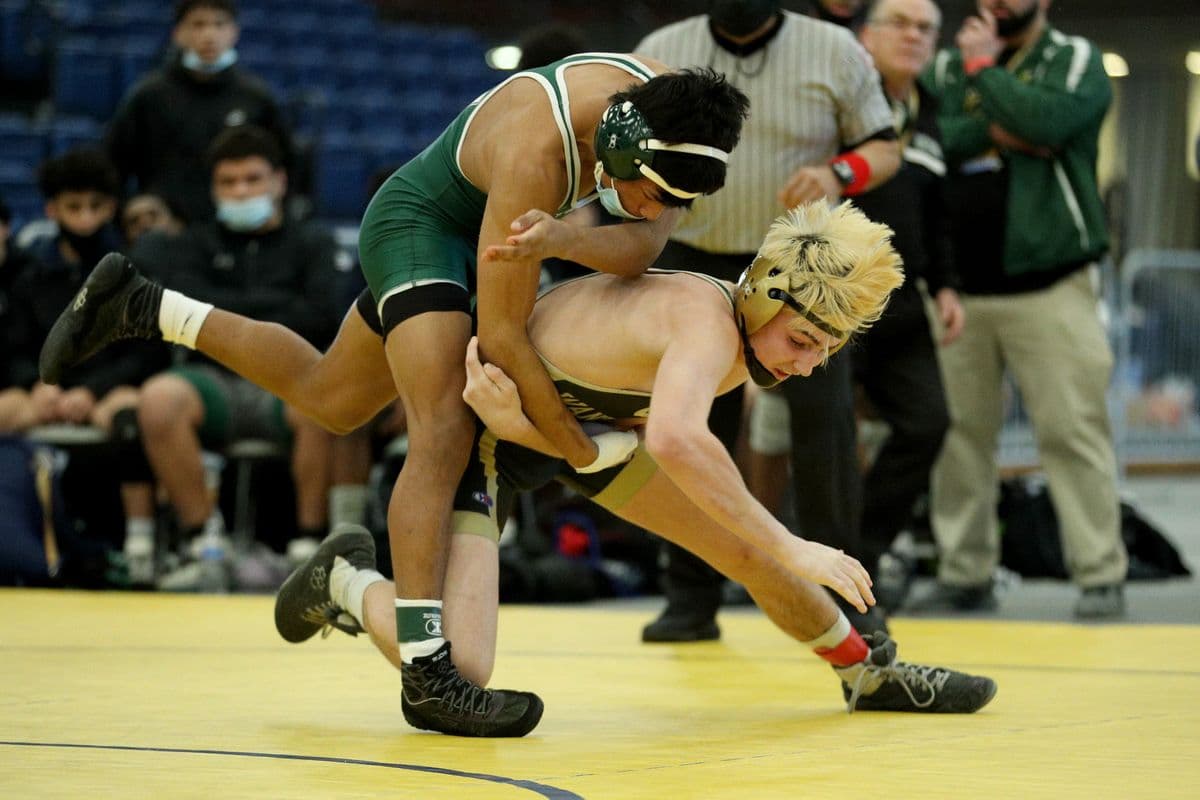 Brentwoods Juan Hernandez, left, wrestles Wantaghs Thomas Bonasera during their 138 pound bout at the 2022 NYSPHSAA Wrestling Dual Meet Championships at SRC Arena in Syracuse, N.Y. on Jan. 29, 2022.