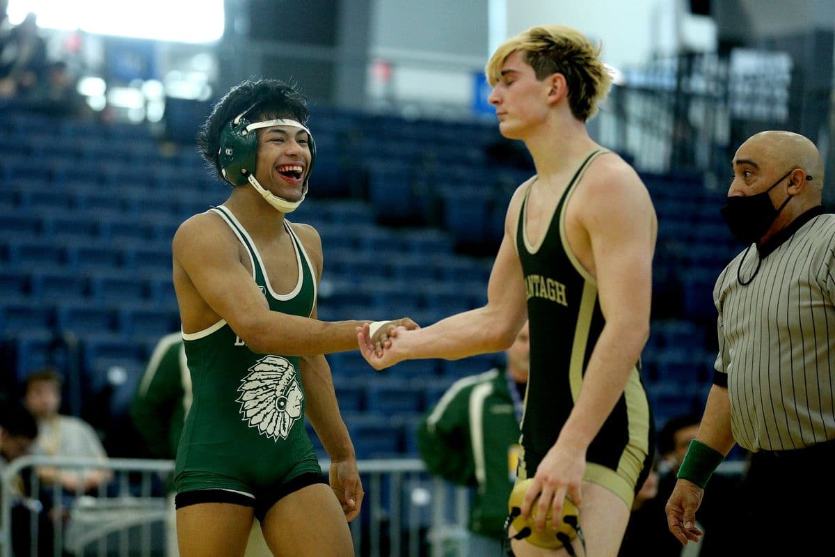 Brentwoods Juan Hernandez, left, reacts after wrestling Wantaghs Thomas Bonasera in a 138 pound bout at the 2022 NYSPHSAA Wrestling Dual Meet Championships at SRC Arena in Syracuse, N.Y. on Jan. 29, 2022.
