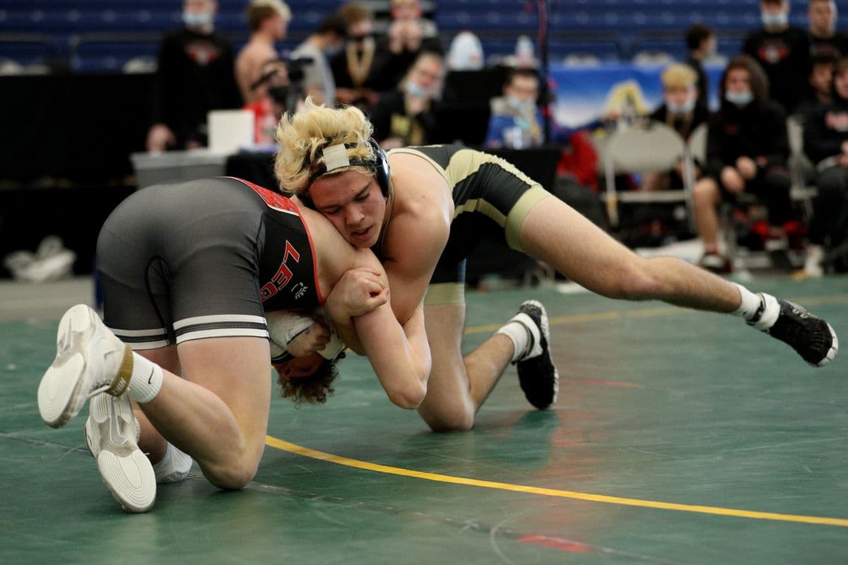 Lancasters Michael Schaefer, left, and Wantaghs Noah Corwin wrestle during their 172 pound bout at the 2022 NYSPHSAA Wrestling Dual Meet Championships at SRC Arena in Syracuse, N.Y. on Jan. 29, 2022.