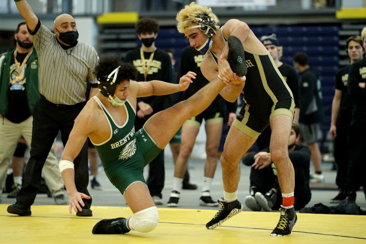 Brentwoods Michael Hernandez attempts to escape Wantaghs Ben Rogers during their 160 pound bout at the 2022 NYSPHSAA Wrestling Dual Meet Championships at SRC Arena in Syracuse, N.Y. on Jan. 29, 2022.