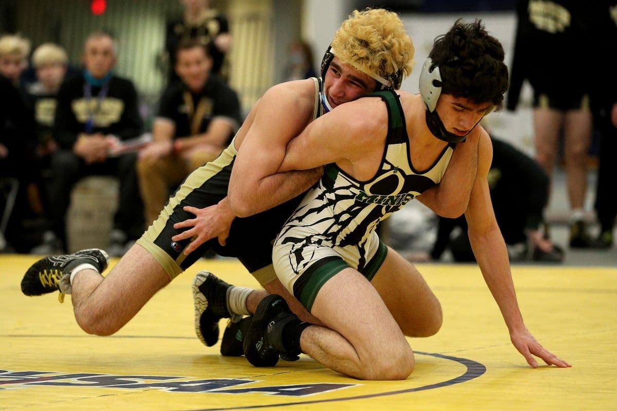 Wantagh's Ben Rogers, top, wrestles Minisink Valley's Eric Tigue during their 152 pound bout at the 2022 NYSPHSAA Wrestling Dual Meet Championships at SRC Arena in Syracuse, N.Y. on Jan. 29, 2022.