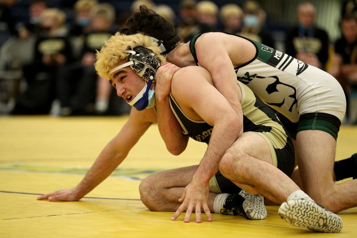 Wantagh's Ben Rogers, bottom, wrestles Minisink Valley's Eric Tigue during their 152 pound bout at the 2022 NYSPHSAA Wrestling Dual Meet Championships at SRC Arena in Syracuse, N.Y. on Jan. 29, 2022.