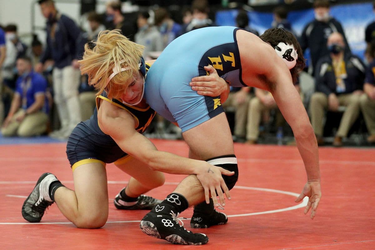 Shoreham-Wading Rivers Matt Greco, left, attempts to take down Central Valley Academys Cole Wheet during their 160 pound bout at the 2022 NYSPHSAA Wrestling Dual Meet Championships at SRC Arena in Syracuse, N.Y. on Jan. 29, 2022.
