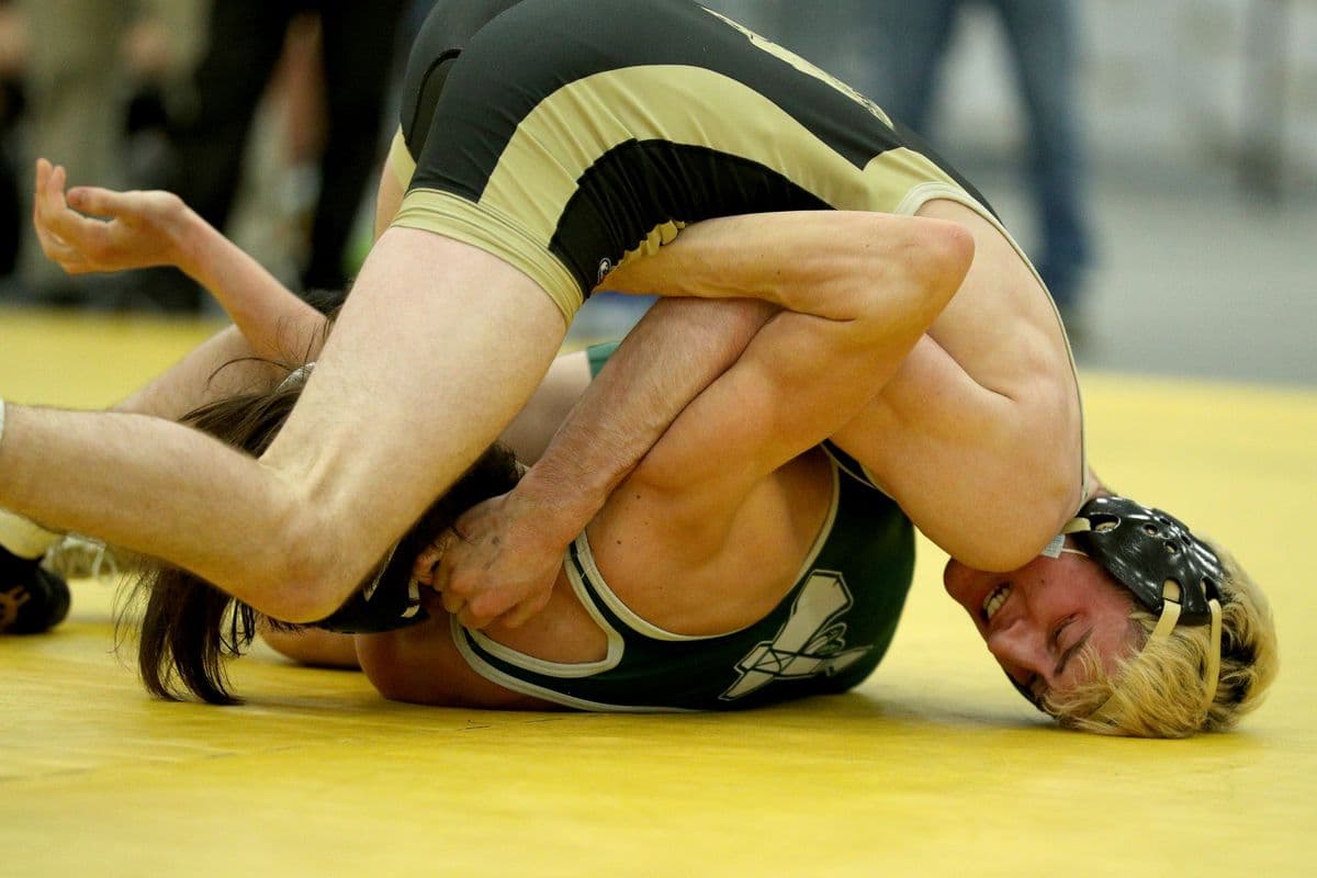 Wantagh's Ryan Arbeit looks to pin Brentwood's Kendricks Pellicci during their 126 pound bout at the 2022 NYSPHSAA Wrestling Dual Meet Championships at SRC Arena in Syracuse, N.Y. on Jan. 29, 2022.