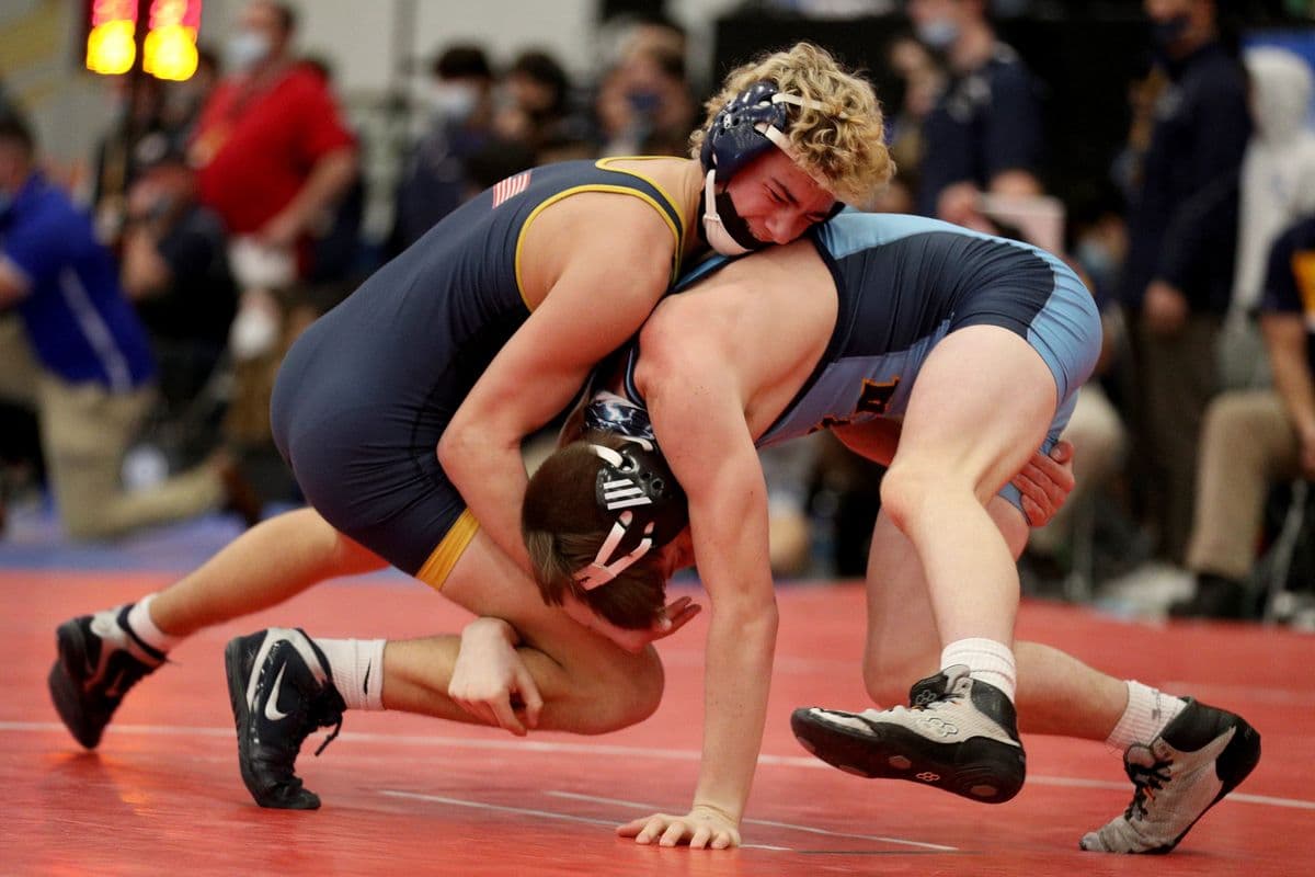 Shoreham-Wading Rivers Tommy Palumbo, left, wrestles Central Valley Academys Cooper Reed during their 126 pound bout at the 2022 NYSPHSAA Wrestling Dual Meet Championships at SRC Arena in Syracuse, N.Y. on Jan. 29, 2022.