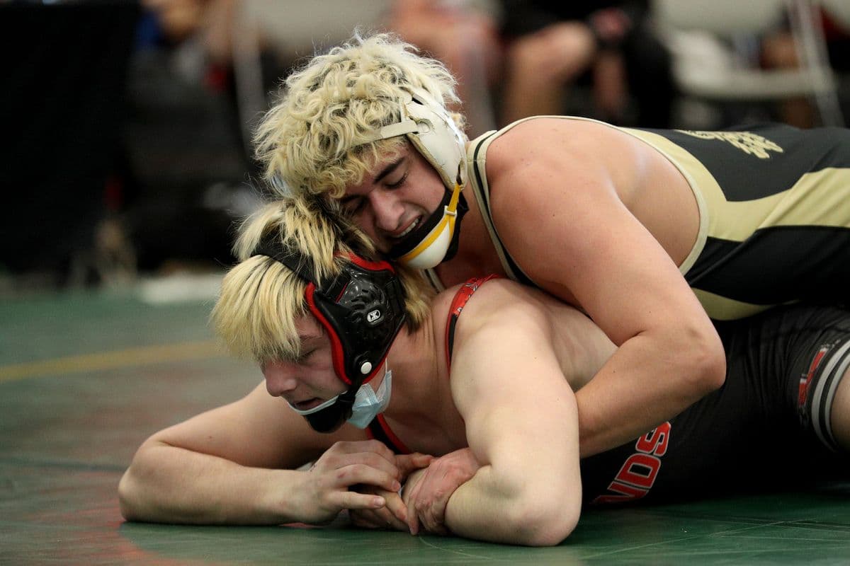 Wantaghs Ethan Merone, top, wrestles Lancasters Evan Stencel during their 189 pound bout at the 2022 NYSPHSAA Wrestling Dual Meet Championships at SRC Arena in Syracuse, N.Y. on Jan. 29, 2022.