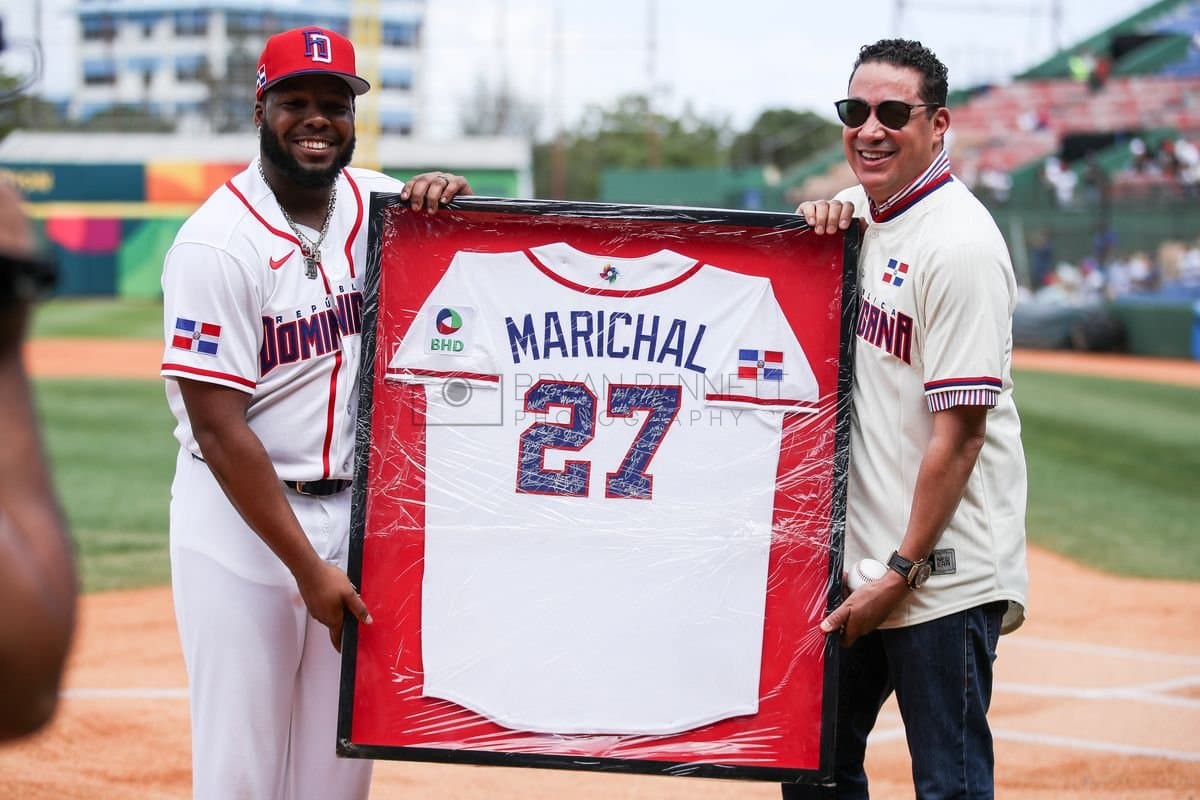 SANTO DOMINGO, DOMINICAN REPUBLIC - MARCH 04: Vladimir Guerrero Jr. #27 of the Dominican Republic and Juan Marichal Jr. are photographed prior to an exhibition game between the Detroit Tigers and the Dominican Republic at Estadio Quisqueya on March 04, 2026 in Santo Domingo, Dominican Republic. (Photo by Bryan Bennett/Getty Images)