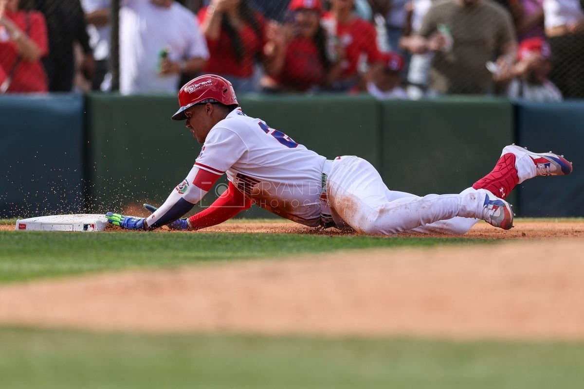SANTO DOMINGO, DOMINICAN REPUBLIC - MARCH 04: Juan Soto #22 of the Dominican Republic slides into third base during the third inning of an exhibition game against the Detroit Tigers at Estadio Quisqueya on March 04, 2026 in Santo Domingo, Dominican Republic. (Photo by Bryan M. Bennett/Getty Images)